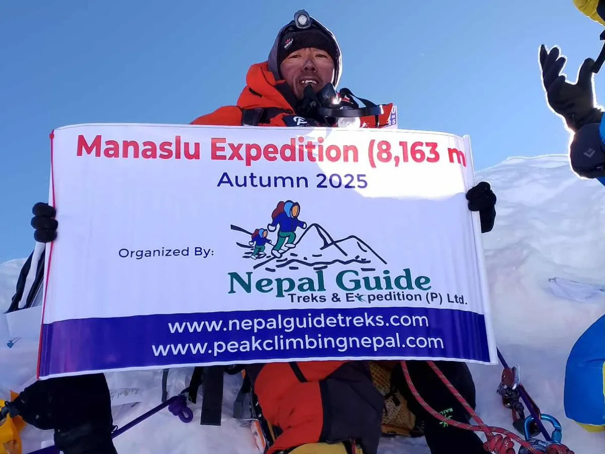 Manaslu Expedition and sherpa with banner at the top