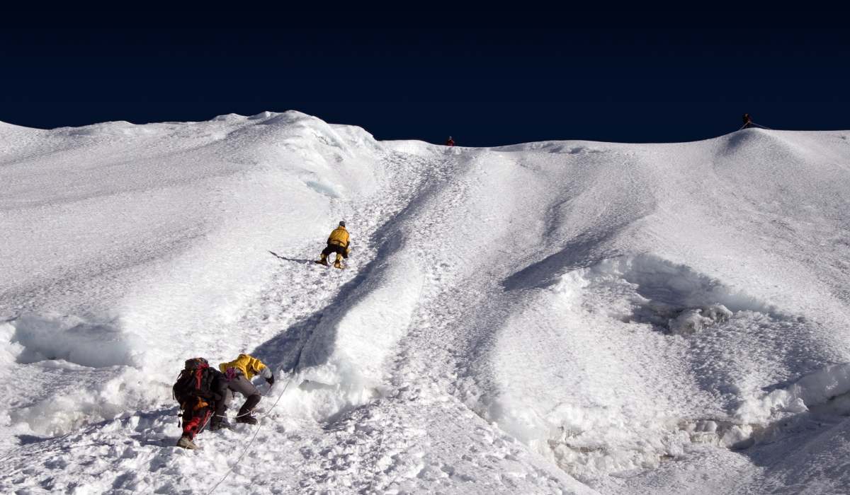 people climbing Island Peak with rope in nepal