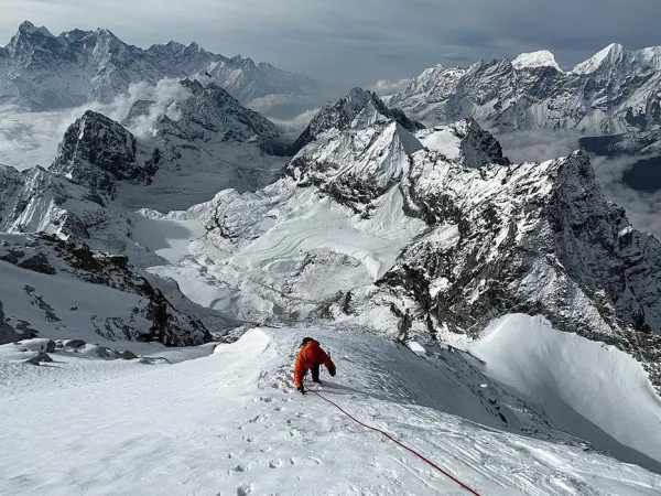 Climber Climbing The Pachermo And Kyajo Ri Peak