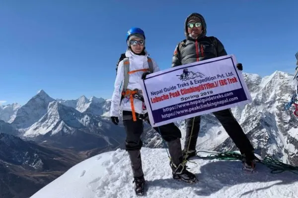Lobuche Climbing  with guest and guide at the top