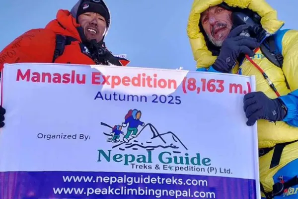 Manaslu Expedition and guest with guide at the top